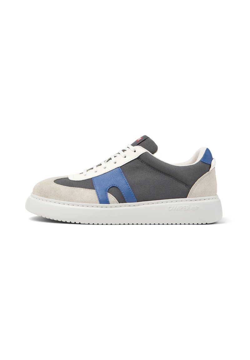 Low-top sneakers in gray canvas with white and blue suede accents, round toe, and white rubber sole featuring textured tread.