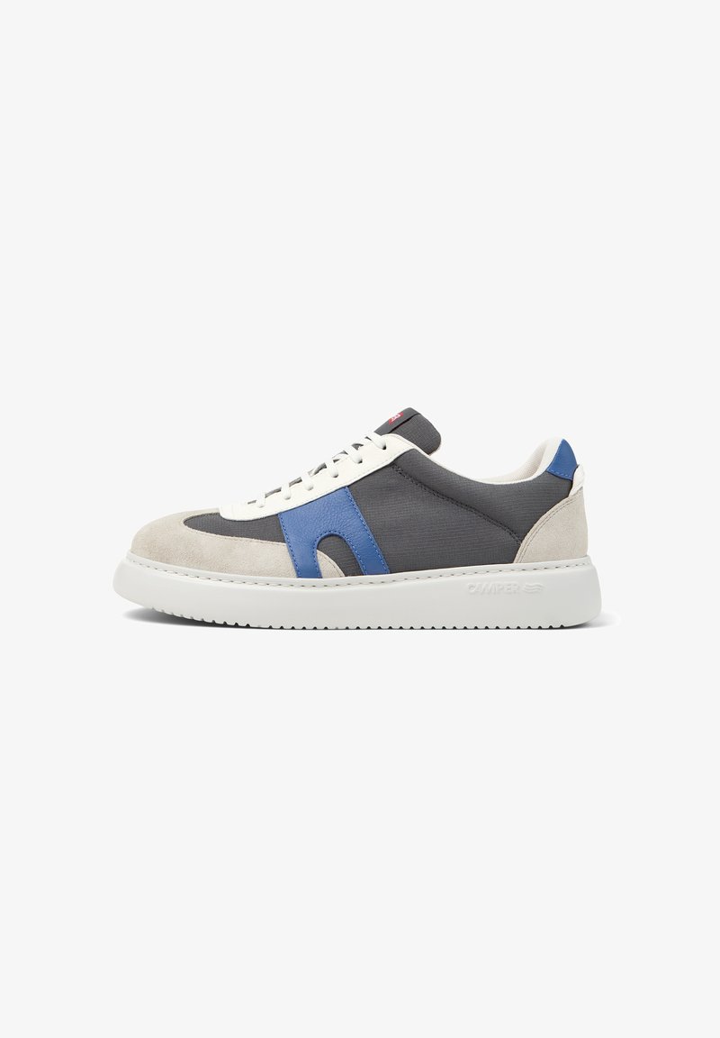 Low-top sneakers in gray canvas with white and blue suede accents, round toe, and white rubber sole featuring textured tread.