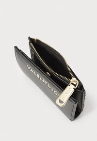 Black leather wallet with gold-tone zipper, featuring "VALENTINO" embossed on the front, interior card slots, and zipped compartment.