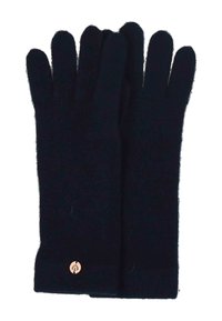 Par de guantes largos de punto negros con un pequeño emblema redondo dorado cerca de la muñeca sobre un fondo blanco.