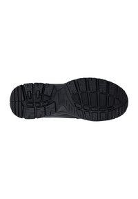 Zwarte rubberen schoenzool met een textuurprofiel voor grip. Kenmerken zijn diepe groeven en ribbels voor verbeterde grip en duurzaamheid.