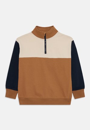 Color-blocked sweatshirt featuring beige, brown, and navy sections, high collar, half zipper, and ribbed cuffs and hem. Soft cotton material.