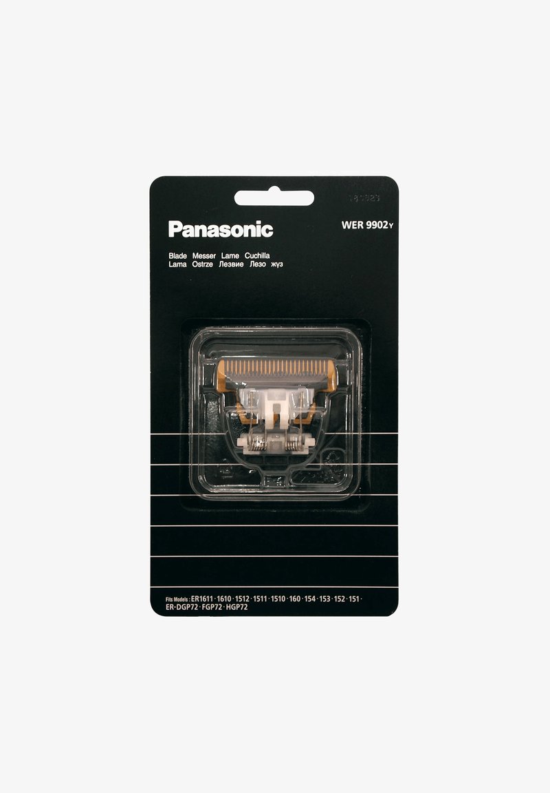 Panasonic mes in transparante verpakking met een witte en oranje kam. Zwarte achtergrond, inclusief meertalig tekst voor productidentificatie.