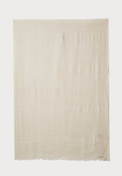 Beige Stoff mit einem Wellenmuster, das durch gepunktete Linien erzeugt wird, mit einem Fransenrand. Weiche Textur, leicht und ideal zum Schichten.