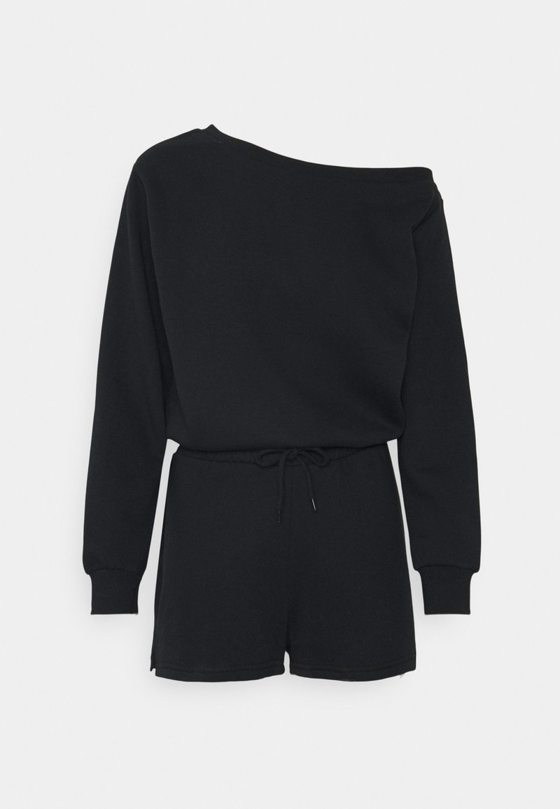 Combinaison noire asymétrique à manches longues, taille ajustable avec cordon et shorts arrivant à mi-cuisse.