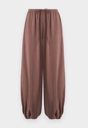 Pantalon marron ample avec taille élastique et cordon de serrage, doté de poignets élastiques froncés aux chevilles.