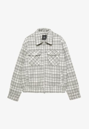 Giacca a quadri grigia e bianca con zip frontale, collo e due tasche sul petto, realizzata in materiale strutturato e caldo. Vita elasticizzata per una vestibilità aderente.