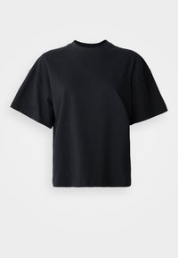 T-shirt in cotone nero con colletto rotondo, maniche corte e vestibilità ampia; presenta un discreto logo sul davanti.