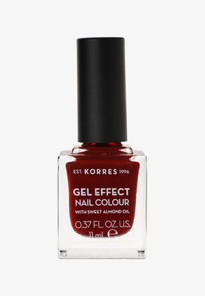 Esmalto in gel effetto Korres di colore rosso intenso, bottiglia in vetro da 11 ml con tappo nero opaco. L'etichetta include testo bianco e dettagli sugli ingredienti.