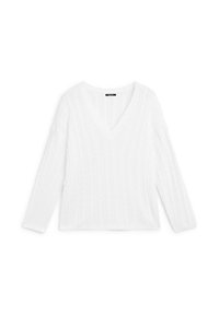 White V-neck sweater with long sleeves, featuring a cable knit texture and a relaxed fit. Smooth, lightweight fabric suitable for layering.