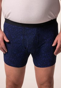 Blauwe boxershorts met bloemenpatroon en een zwarte elastische tailleband. Gemaakt van zachte stof, met een getailleerd ontwerp en een lengte tot halverwege de dij.