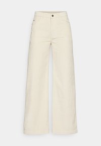 Wijd uitlopende broeken van crème kleurige corduroy stof, met een hoge taille, zijzakken en een enkele knoopsluiting.