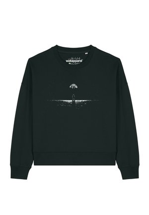 Sweat-shirt noir à manches longues avec un graphisme blanc représentant un astronaute debout sous un reflet de lune ou de planète sur l'eau.