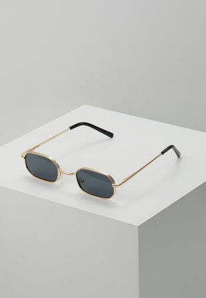 Aurinkolasit - pale gold-coloured