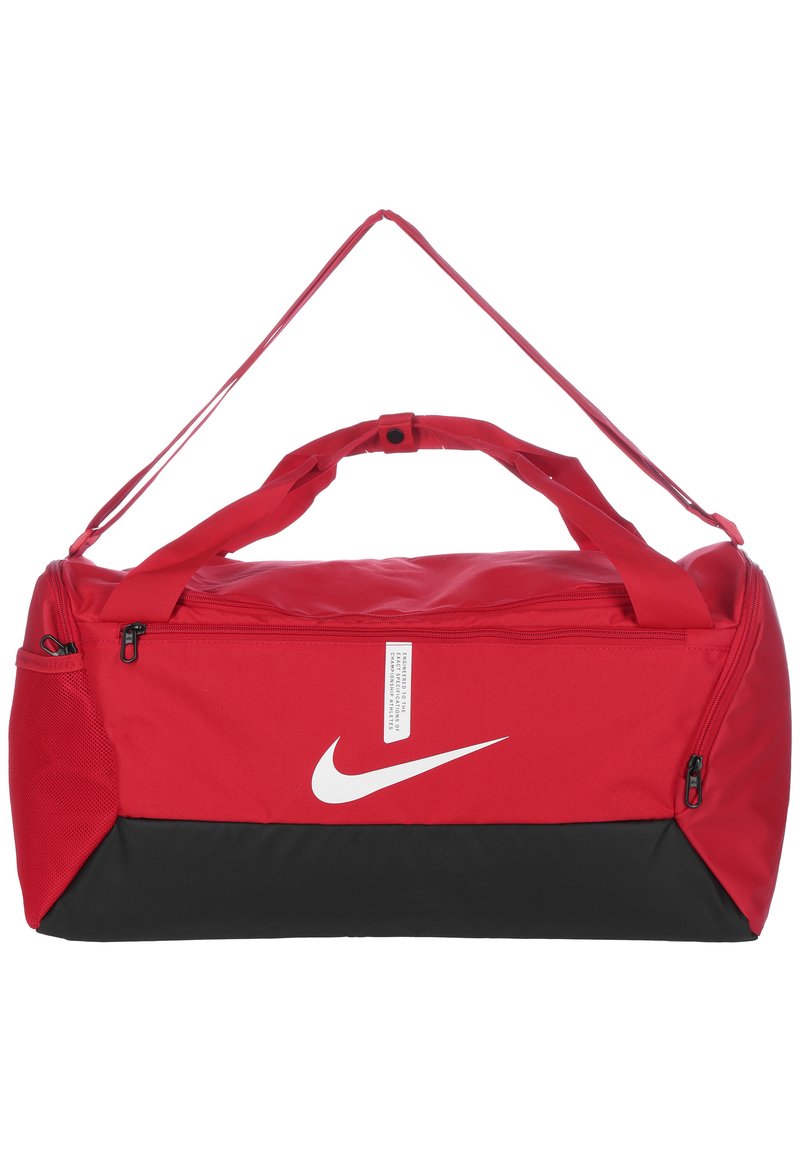 Red duffle bag with black lower section, made of durable nylon. Features a white Nike logo, dual handles, and a zippered compartment.