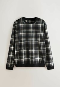 Svart och vit rutig sweatshirt. Tillverkad av mjukt tyg med långa ärmar, rundad halsringning och enfärgade svarta mudd och fåll.