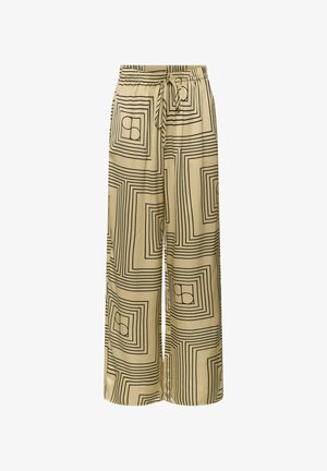 Pantalon beige à jambes larges avec motif géométrique noir de carrés et cercles, taille élastique et cordon de serrage à l'avant.
