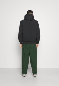 Carhartt WIP Mezisezónní bunda  - black