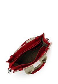 Small beige and red handbag with open top showing empty main compartment and zippered inner pocket.