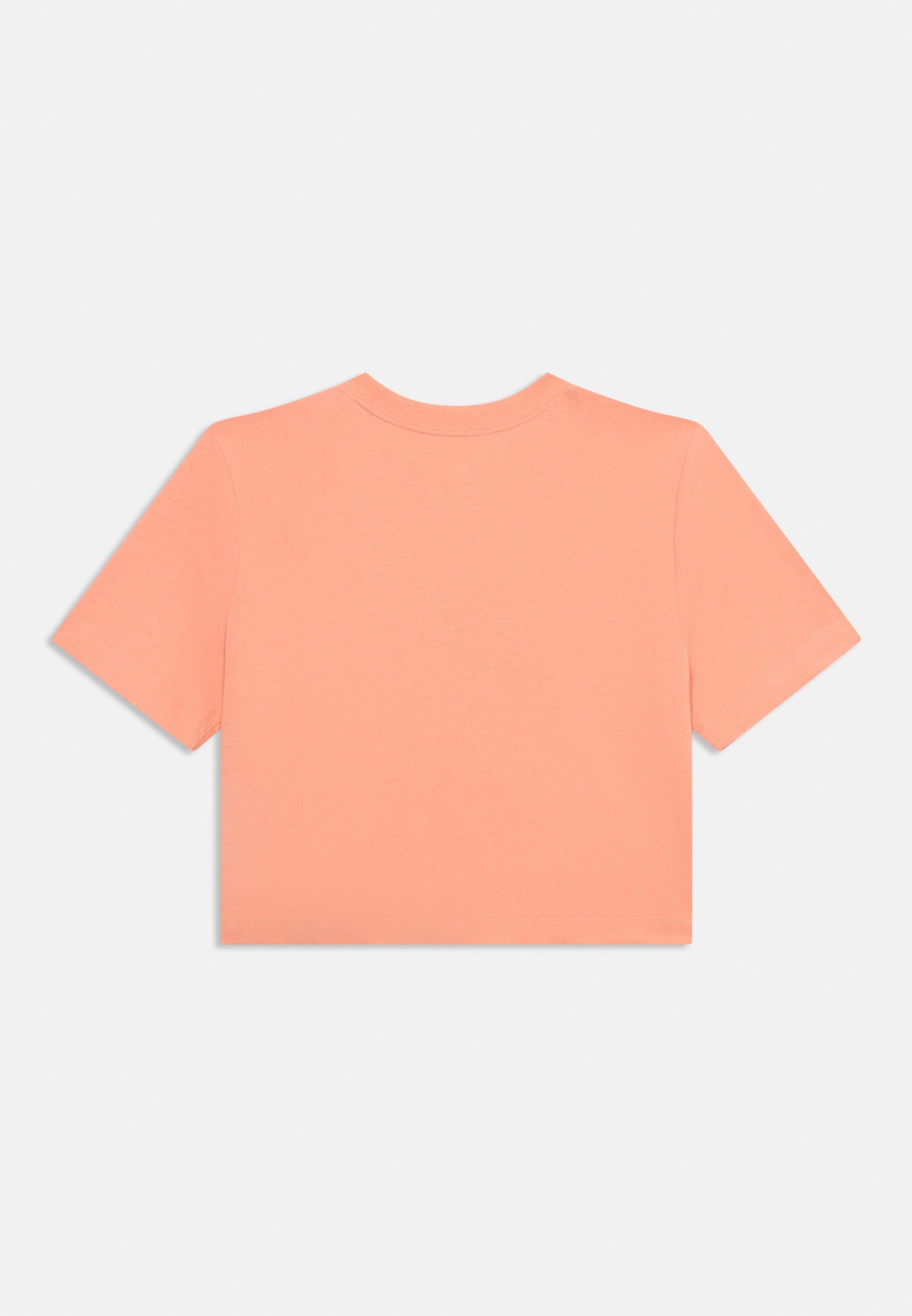 peach color nike shirt