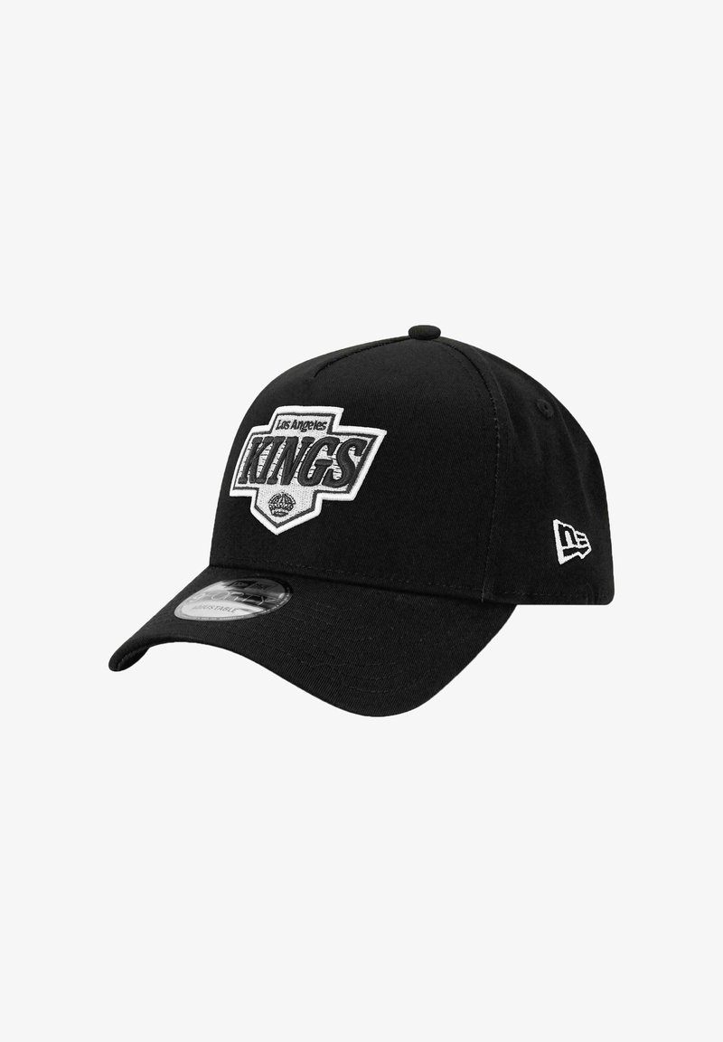 Black baseball cap with an embroidered Los Angeles Kings logo, structured design, curved brim, and New Era logo on the side.