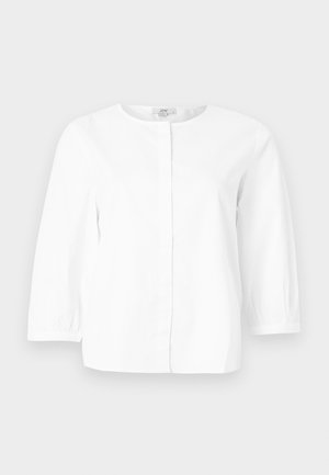 Λευκό μπλούζα μακρυμάνικη με στρογγυλή λαιμόκοψη, κρυφά κουμπιά μπροστά και ελαφρώς σούρες μανσέτες, εμφανίζεται σε απλό φόντο.