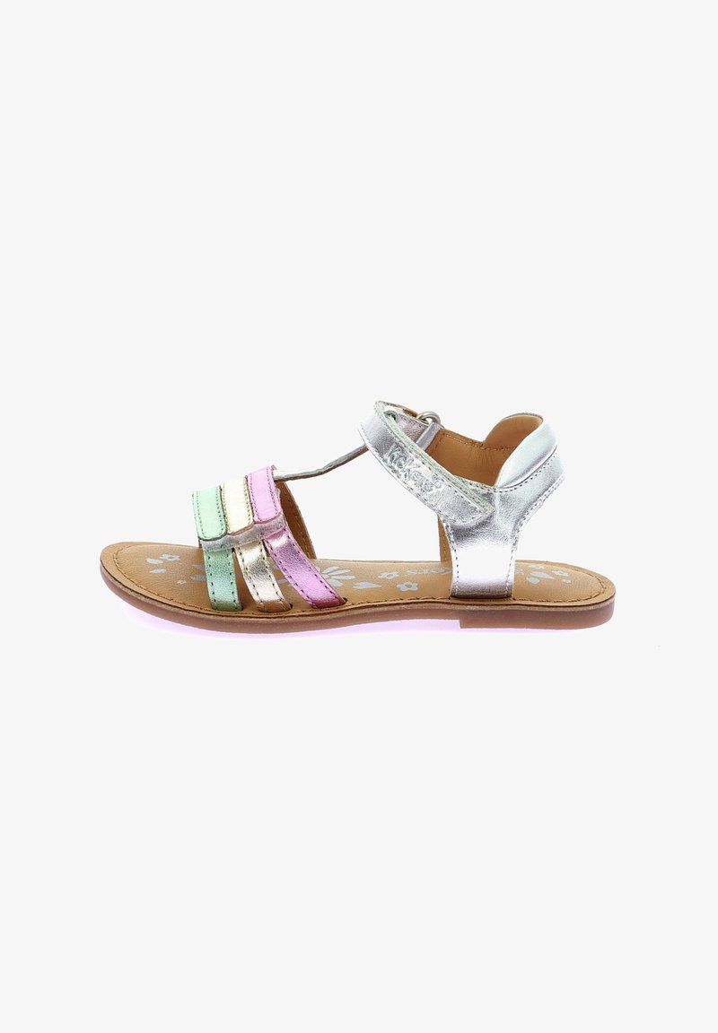 Metallic sandals featuring pink, green, and silver straps. Flat sole with floral pattern on brown footbed and adjustable strap at the back.