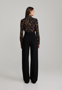 ANDIATA LUCIA - Pantaloni - black