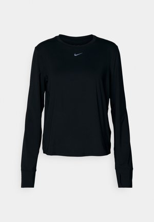 T-shirt noir à manches longues Nike avec un col rond, en tissu doux, coupe régulière et petit logo réfléchissant sur la poitrine.