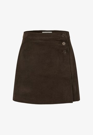 Pruunist korduroost seelik, millel on ümar lõige, sile vöökoht ja kaks nuppu vasakul küljel. Vertikaalne ribakujuline tekstuur.