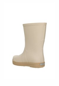 Botte en caoutchouc imperméable beige avec une finition lisse et brillante. Dispose d'une semelle en caoutchouc texturée et d'un léger talon pour une meilleure traction.