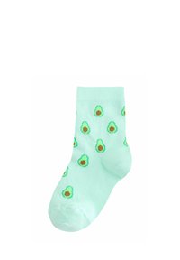 Hele-roheline sokk, mille kangal on ühtlaselt laiali puistatud väikeste avokaado poolikutega mustriga.