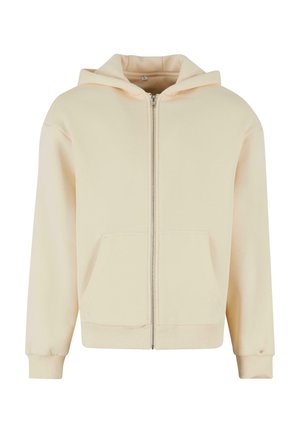 Cremfarbener Reißverschluss-Hoodie aus weichem Stoff, mit Kapuze, zwei Fronttaschen und gerippten Bündchen und Saum. Glatte Textur.