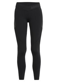 Leggings sportivi neri con vita alta, caratterizzati da un design incrociato e dettagli testurizzati sui lati. Logo sulla vita.