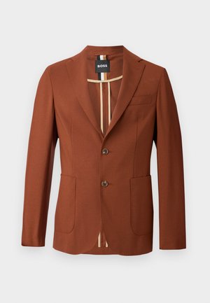 Brauner Blazer mit maßgeschneidertem Design, ausgestattet mit zwei Vorderaschen, zwei Knöpfen und einem gestreiften Innenfutter. Geschmeidige Textur, strukturierte Form.