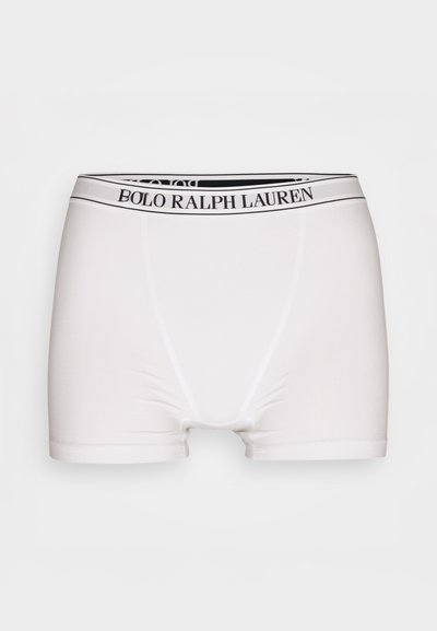 Fehér boxer alsó fekete rugalmas derékkal, rajta a "BOLO RALPH LAUREN" felirattal. Simító, rugalmas anyagból készült.