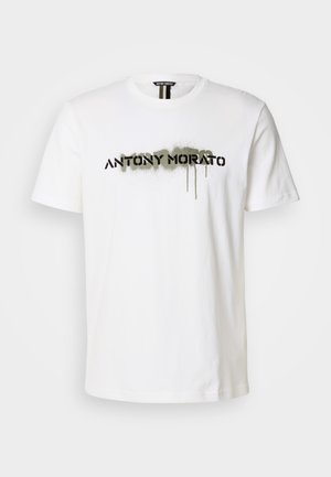 White cotton t-shirt featuring a bold black "ANTONY MORATO" logo with green spray paint accents, round neckline, and short sleeves.