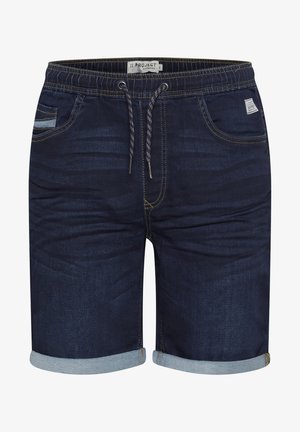 Tummansinisiä farkkuhousuja, joissa on käänteet, nauhavyötärö, viisi taskua sekä keltaiset ommeltu yksityiskohtia. Sisältää hienovaraisia tekstuurivaihteluita.