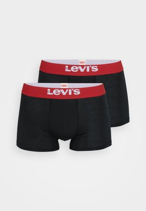Schwarze Baumwollboxershorts mit rohem elastischem Bund, der mit dem weißen "Levi's"-Logo versehen ist. Glatte Textur, figurbetontes Design. Zwei Paare ausgestellt.