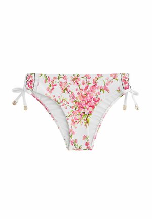 Weißer Bikini-Slip mit rosa Blumenmuster und seitlichen Bändchen, die kleine goldene Perlen tragen, vor schlicht weißem Hintergrund.
