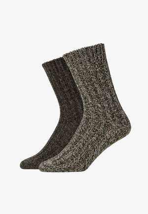 Due coppie di calze di lana, una di un grigio scuro e l'altra di un grigio più chiaro, con una texture a coste e motivi a macchie a contrasto.