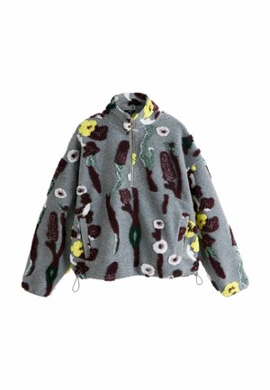 Tufted fleece pullover in grey with vibrant floral patterns in yellow, white, burgundy, and green. Features a half-zip, two side pockets, and a stand collar.