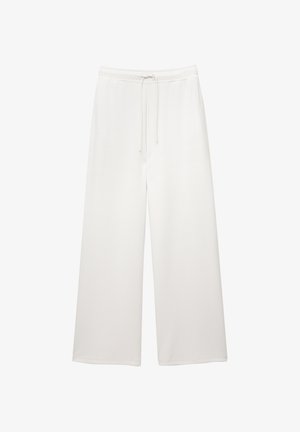 Pantalons larges blancs amples avec taille élastique et cordon de serrage, conçus pour un look décontracté.