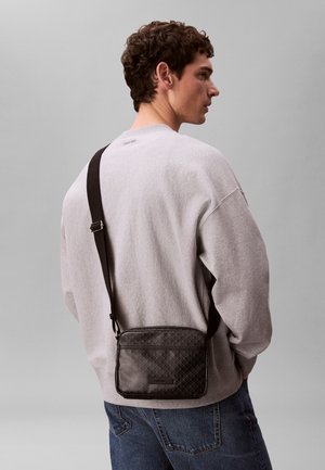 Calvin Klein, EMBLEM CAMERA - Cross body bag - black