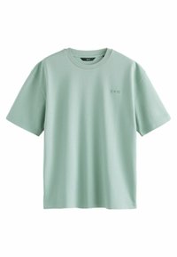 Lys grøn kortærmet t-shirt lavet af blødt stof. Har en rund halsudskæring og et diskret logo på brystet.