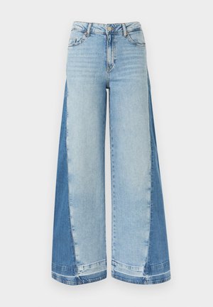 Spodnie dzwony z jasnoniebieskimi przednimi panelami i ciemniejszymi niebieskimi bocznymi panelami, wyposażone w zapięcie na guzik i zamek oraz szlufki na pasek.