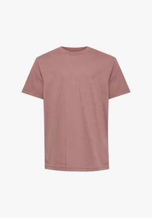 Kortærmet t-shirt i støvet rosa, lavet af blød bomuld, med rund hals og lille logoaccent på brystet. Glat tekstur.