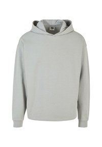 Lys grå pullover hoodie lavet af blødt, tekstureret stof. Har en stor hætte, lange ærmer og en let sænket skulderdesign.
