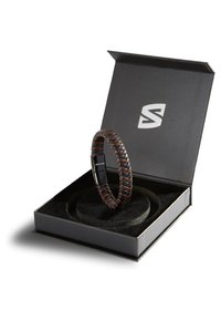 Braided leather bracelet in dark brown and black, presented in a square black box with a velvet interior and a silver logo.