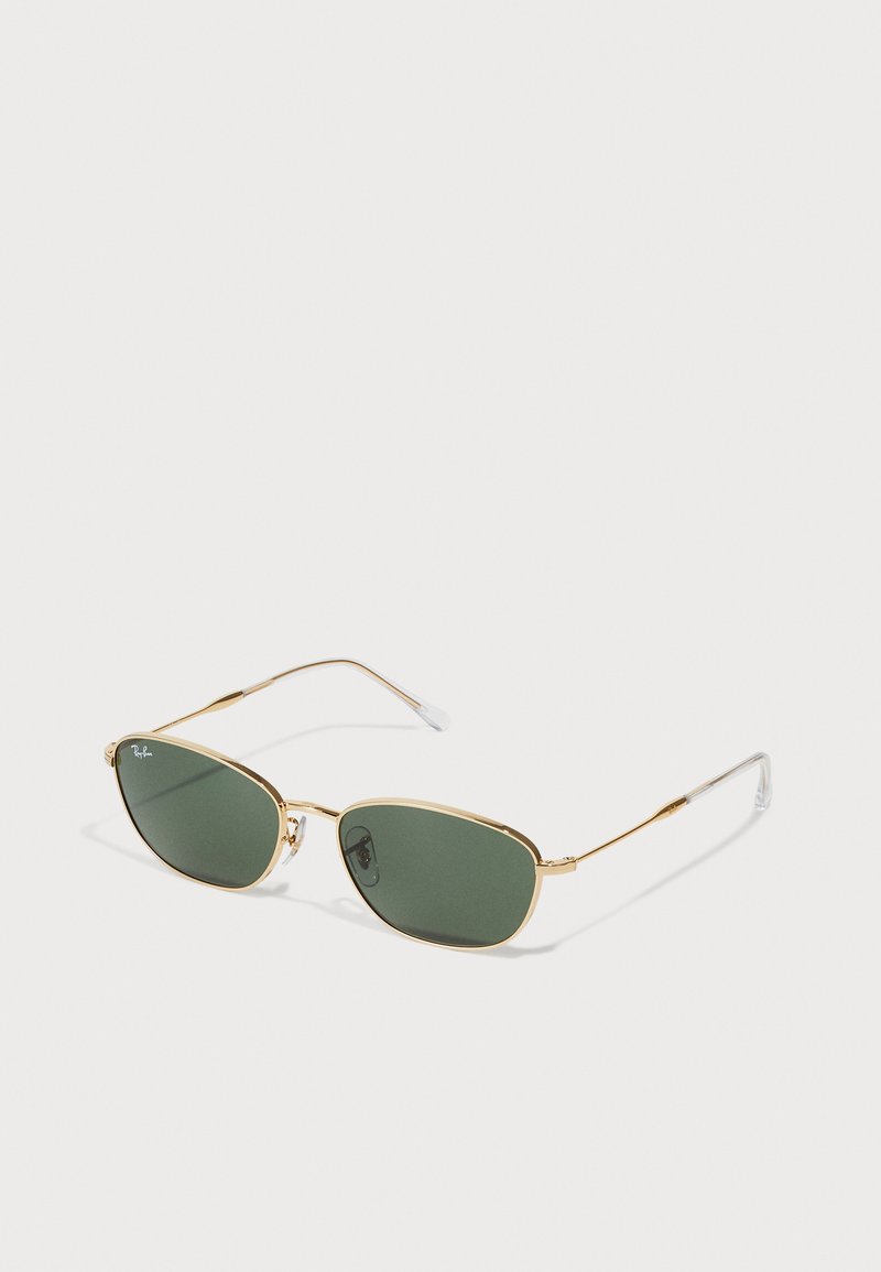 Gold-framed sunglasses with oval green lenses. Features thin metal arms and clear plastic temple tips. Minimalist design with refined lines.